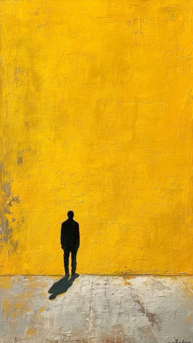 Силует людини на жовтому фоні як символ самотності та наслідків булінгу в школі